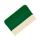 Grøn skraber med filt kant, kompakt og rektangulær, velegnet til forskellige anvendelser.