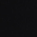 En sort overflade med en let skinnende tekstur, der reflekterer lys diskret.