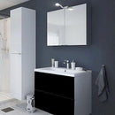 Badeværelsesmøbel med vask, to sorte skuffer og spejl med lys, moderne stil.