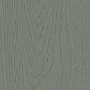 Overflade med træmønster i mat, dæmpet grøn farve, der minder om røgfyldt skov.